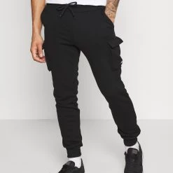 Le moins cher ✔️ YOURTURN UNISEX - Pantalon de survêtement En promotion trouser Normale all 🤩